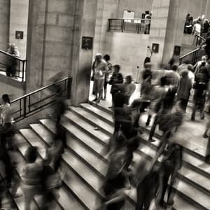 Crowd walking in busy stairwell