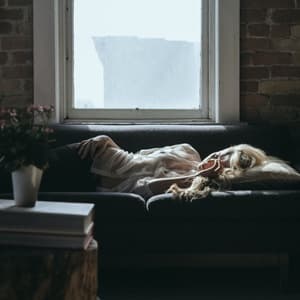 Woman sleeping on couch