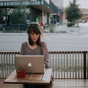 Woman working on laptop at cafe in Austin